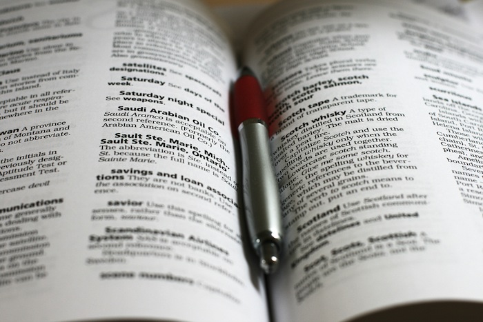 Editing with a pen on a stylebook guide