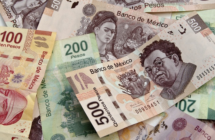 Mexican Pesos bank notes currency bills money background