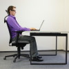 correct sitting position at workstation. man on chair working wi