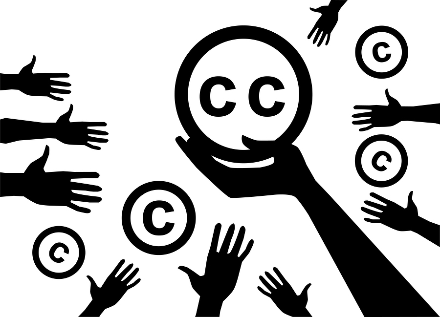 Concep. Hand holding a symbol of licenses Creative commons